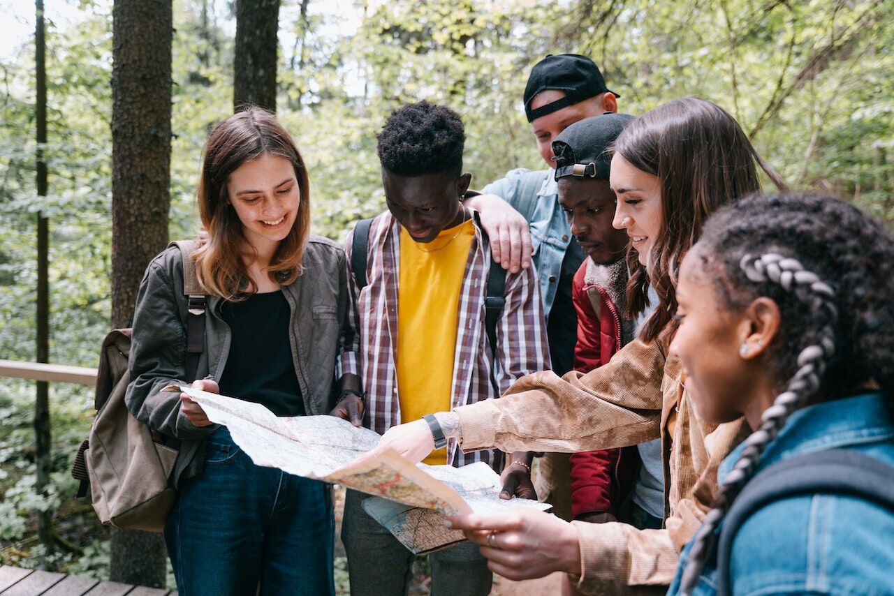 a group of people using a map