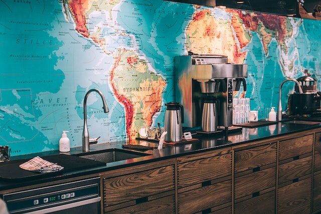 An easy map of the world placed behind office cabinets.